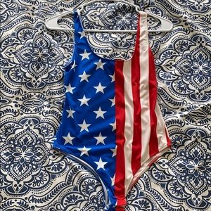 Read white and blue bodysuit